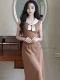  Đầm nâu phối nơ kem 