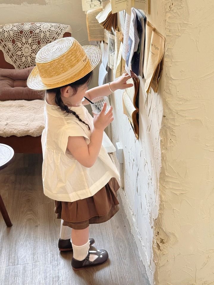 Set Bé Gái Áo Trắng Nhún Ngực Mix Chân Váy Nâu 2 Tầng Có Chip