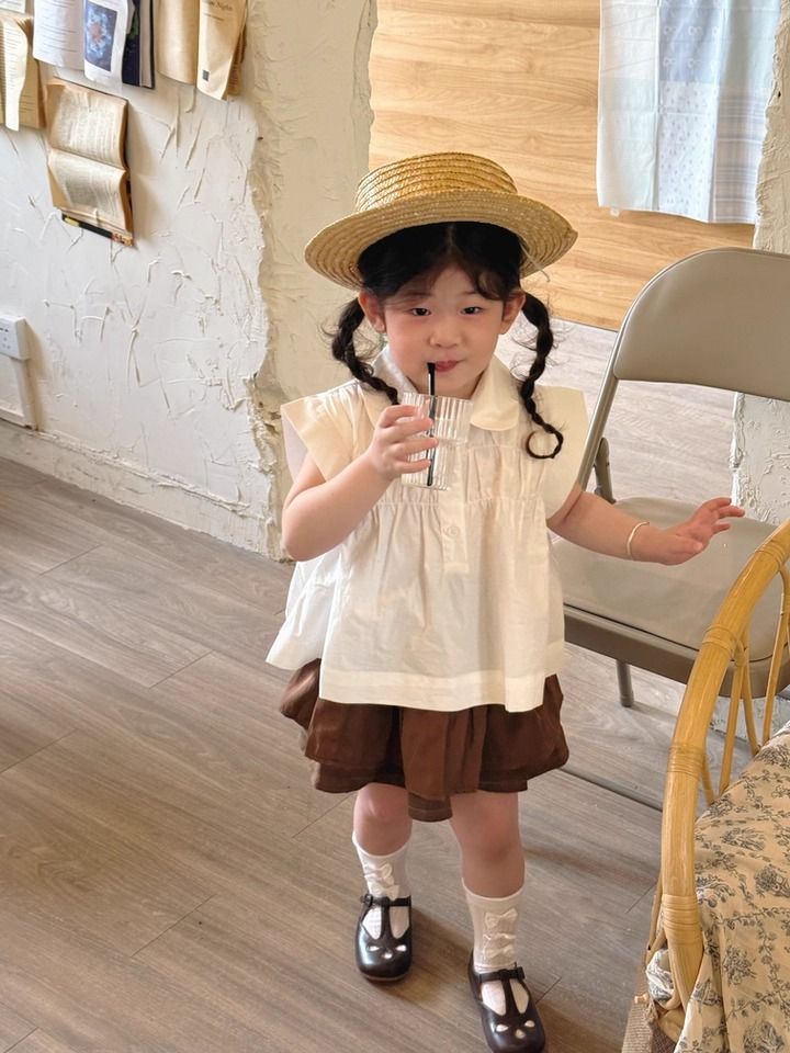 Set Bé Gái Áo Trắng Nhún Ngực Mix Chân Váy Nâu 2 Tầng Có Chip