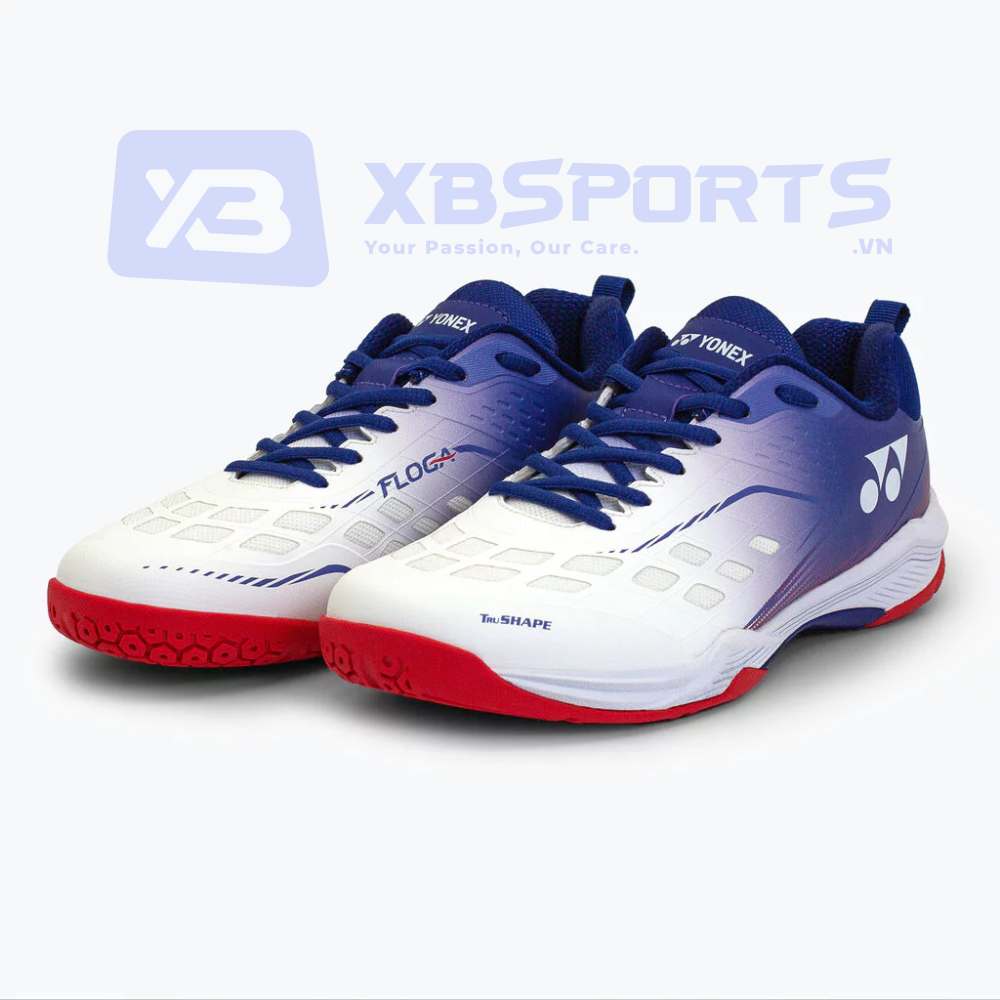 Giày cầu lông Yonex Floga màu White Red, thân trắng chuyển navy ở gót, đế ngoài màu đỏ nổi bật, in chữ FLOGA và Tru.SHAPE ở thân giày, logo Yonex trắng