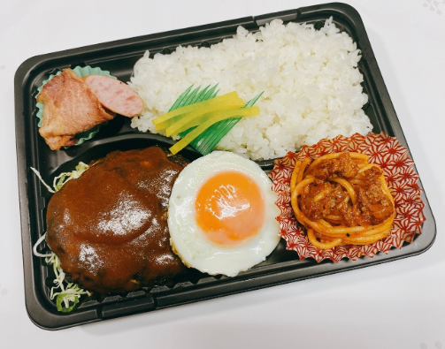  03月10日（火）：目玉焼き『直火焼き！ハンバーグ（デミグラスソース）』弁当 (美味しいドーナツ付） 