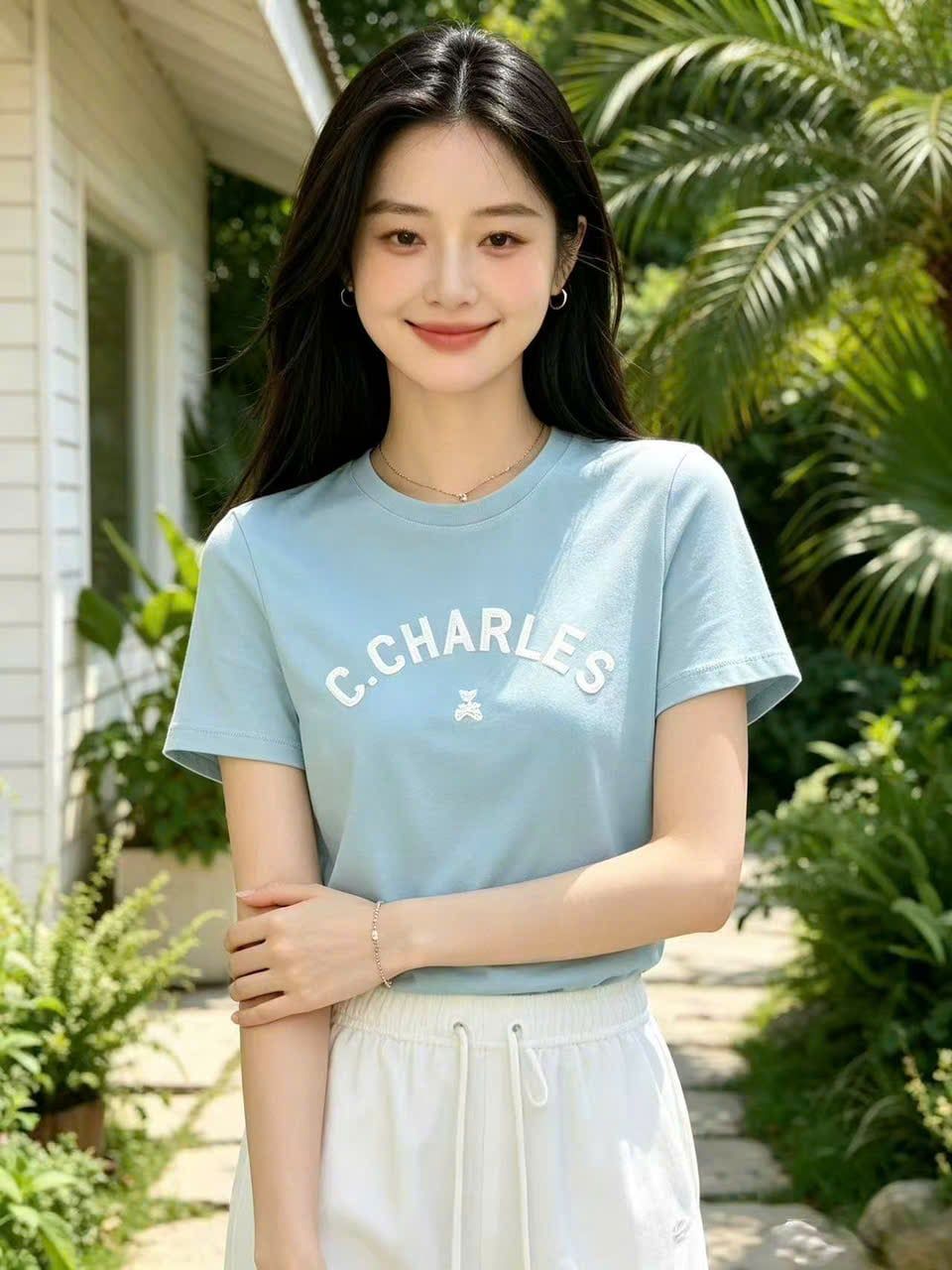  Áo phông xanh, logo gấu dưới chữ CC đính đá 
