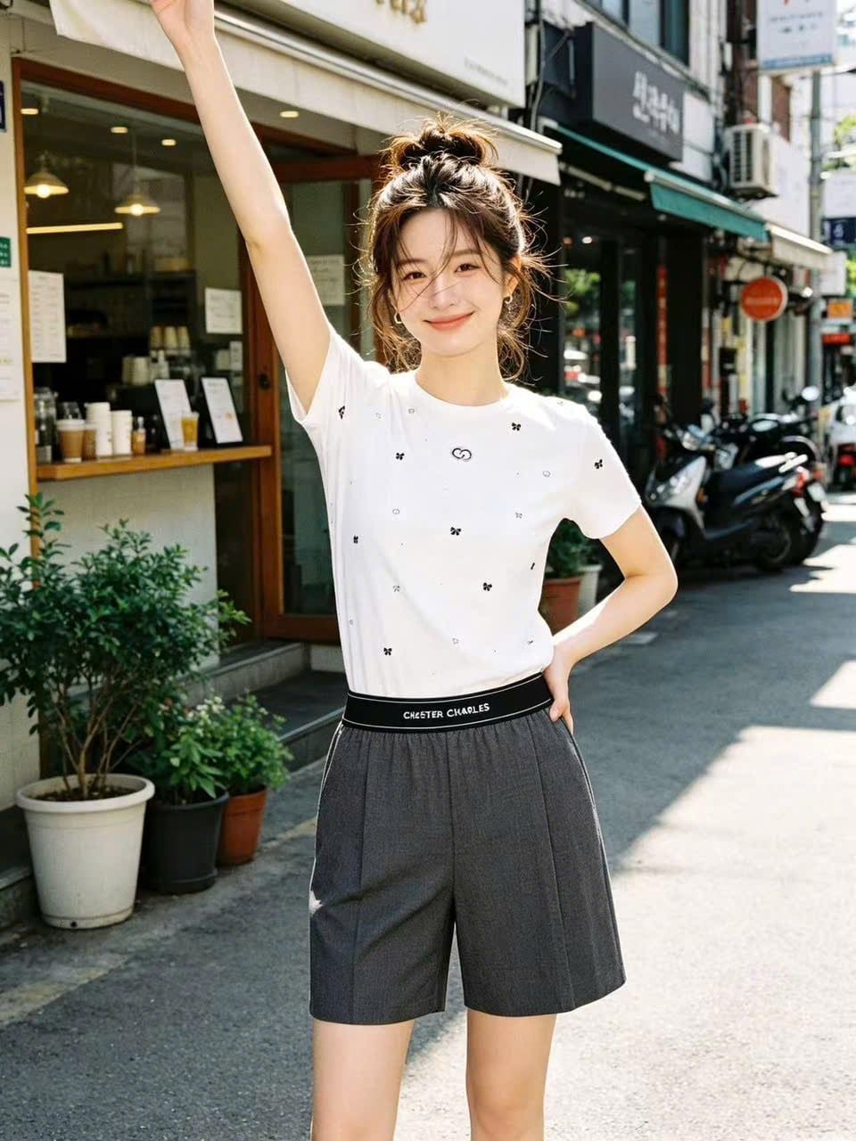  Áo thun trắng dệt thêu nơ đen 