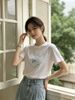  Áo phông trắng trái tim hoa xanh 