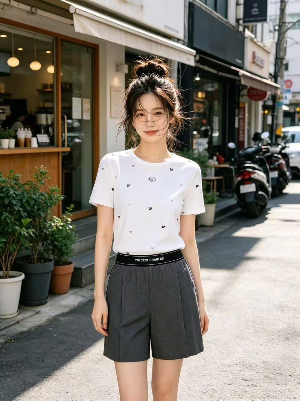  Áo thun trắng dệt thêu nơ đen 