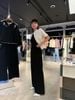  Quần Suông Đen Đính Đá Logo Túi Trái 
