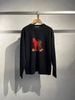  2.Áo len đen dài tay chú ngựa đỏ 
