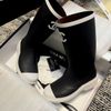  Boot Chanel đen viền trắng 