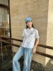  Áo sơ mi trắng logo đen , cổ sen , viền ren 