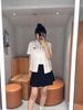  Áo sơ mi trắng logo đen , cổ sen , viền ren 