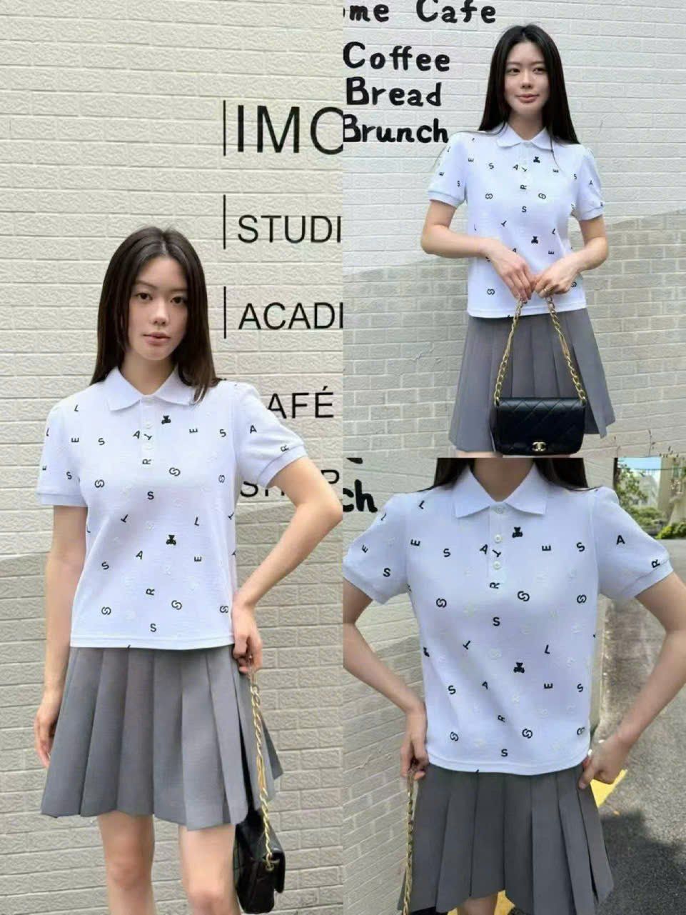  1.Áo polo trắng, họa tiết chữ, gấu đen 