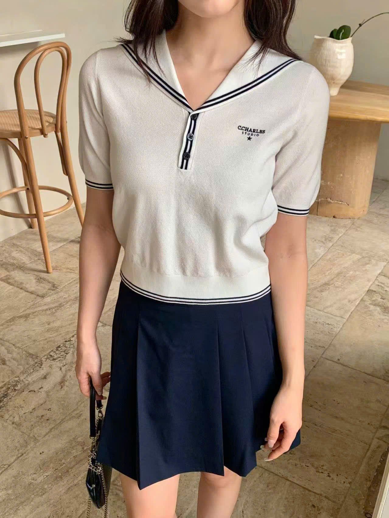  2.Chân váy đen ngắn xếp ly cạp chữ 0636 