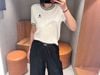  Áo trắng ngắn tay, cổ tròn, viền - gấu đen 