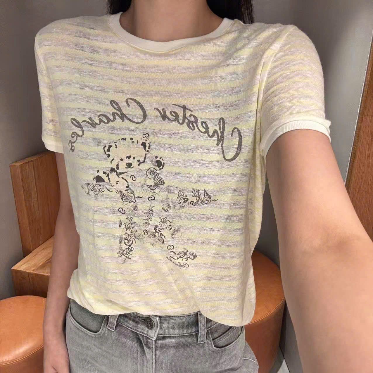  Áo kẻ vàng ngắn tay, ngực gấu ôm sao 