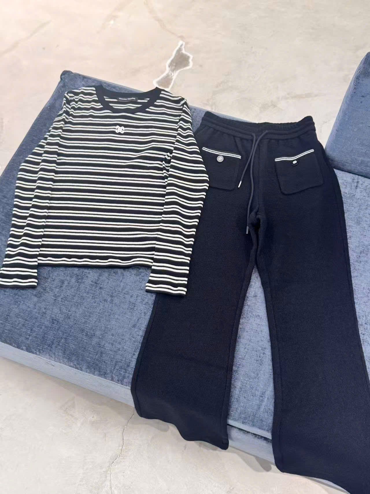  Quần nỉ đen hai túi viền trắng 