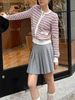  Chân váy ngắn ghi xám xếp ly - cạp chữ trắng 