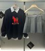  2.Áo len đen dài tay chú ngựa đỏ 