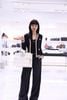  Áo CDG cổ V, màu xanh viền vàng, logo huy hiệu 