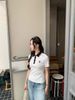  Áo polo trắng cổ đen sọc đỏ ,logo huy hiệu 