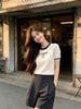  1.Áo trắng viền cổ đen, chữ CC Member 