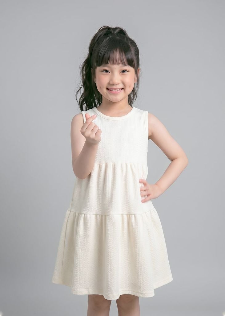 Đầm Kiểu Sát Nách Bé Gái Kem Nhún