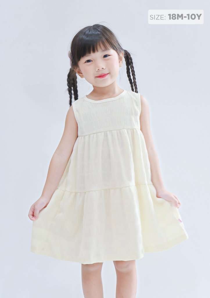 Đầm Thun Kiểu Hai Tầng Bé Gái Vàng Nhạt