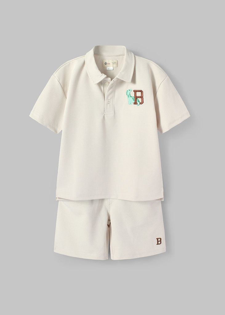 Set Polo Form Rộng Bé Trai Kem Thêu Khủng Long
