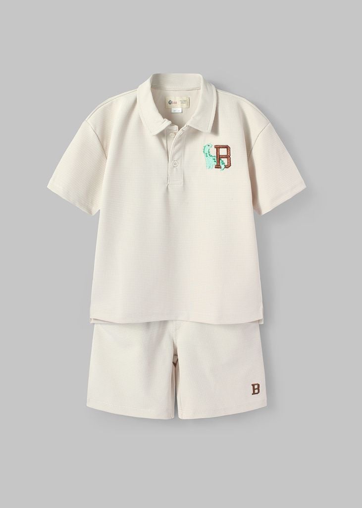 Set Polo Form Rộng Bé Trai Kem Thêu Khủng Long