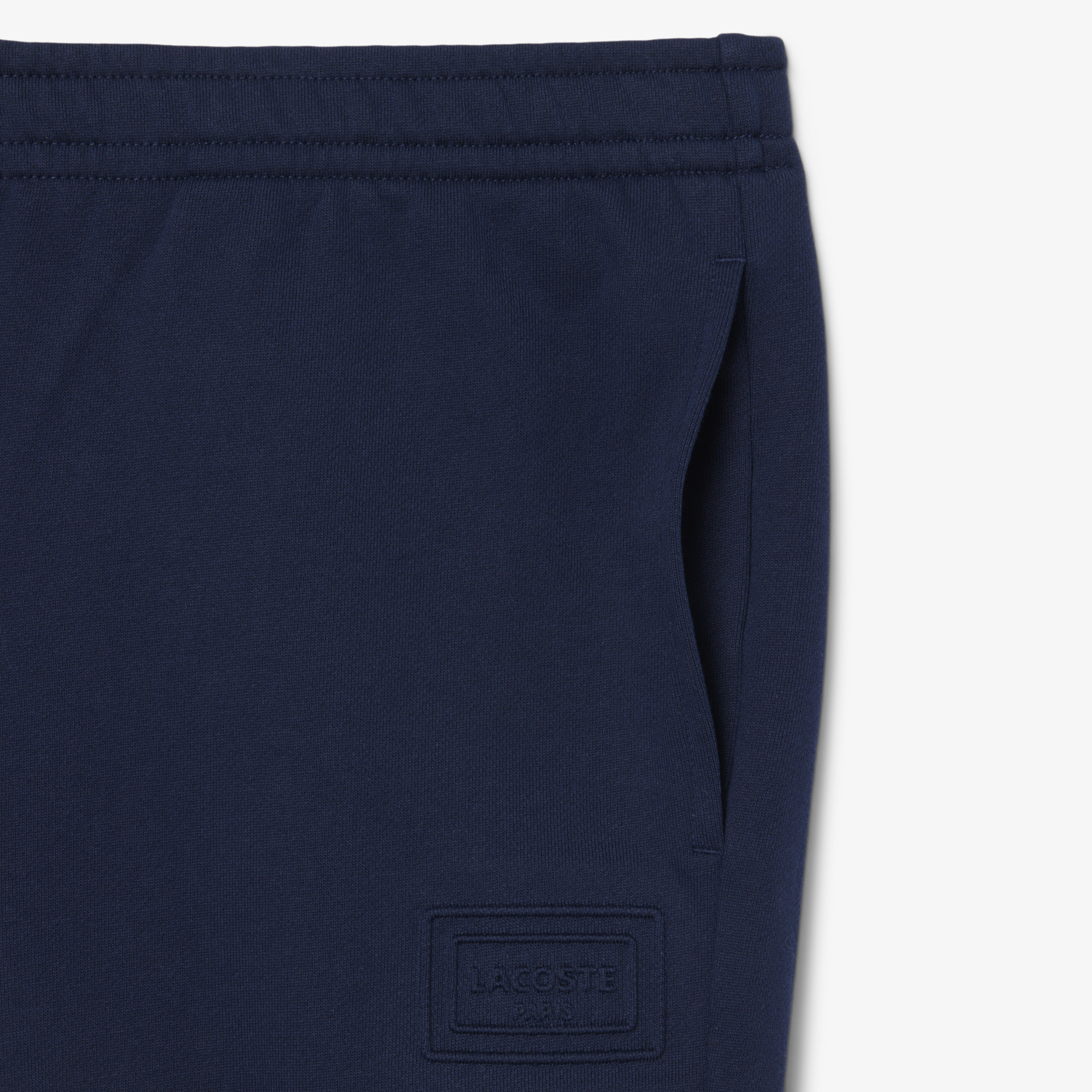 Quần Nỉ Lacoste Unisex Ống Côn Logo Dập Nổi