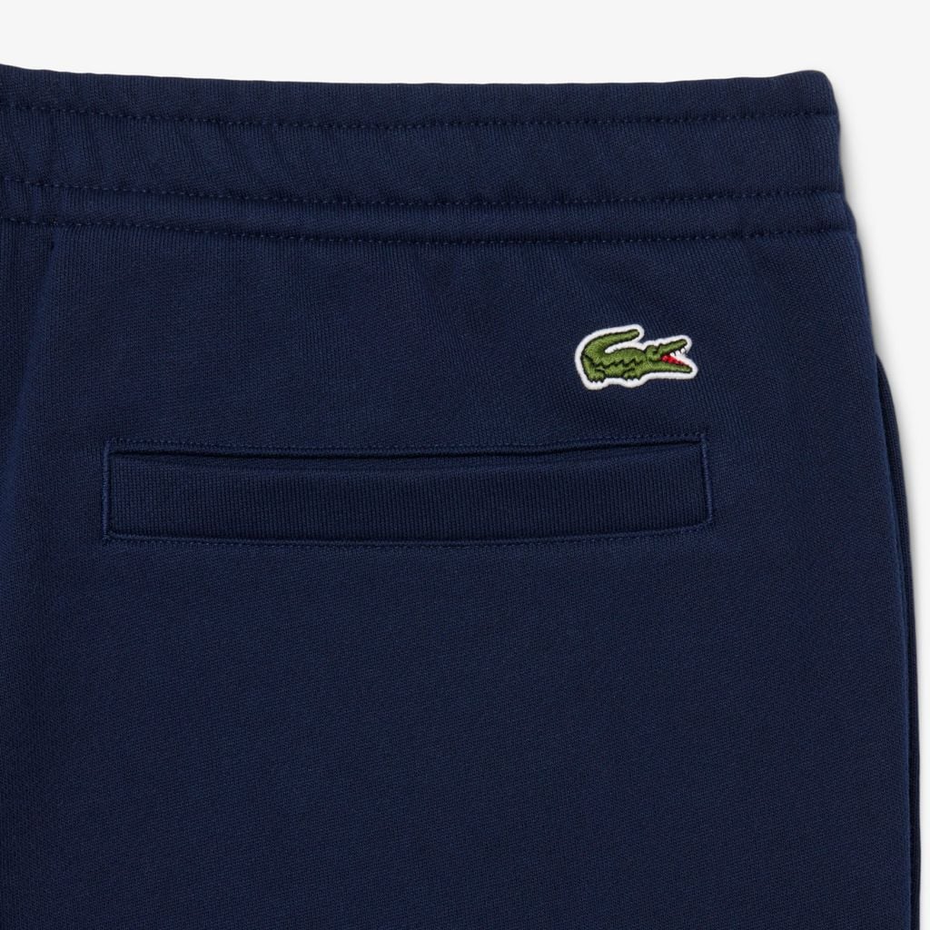 Quần Nỉ Lacoste Unisex Ống Côn Logo Dập Nổi