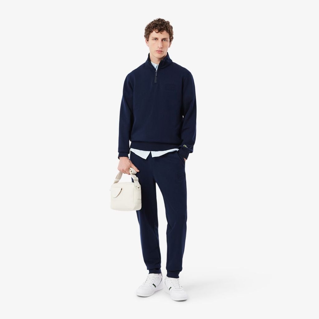 Quần Nỉ Lacoste Unisex Ống Côn Logo Dập Nổi