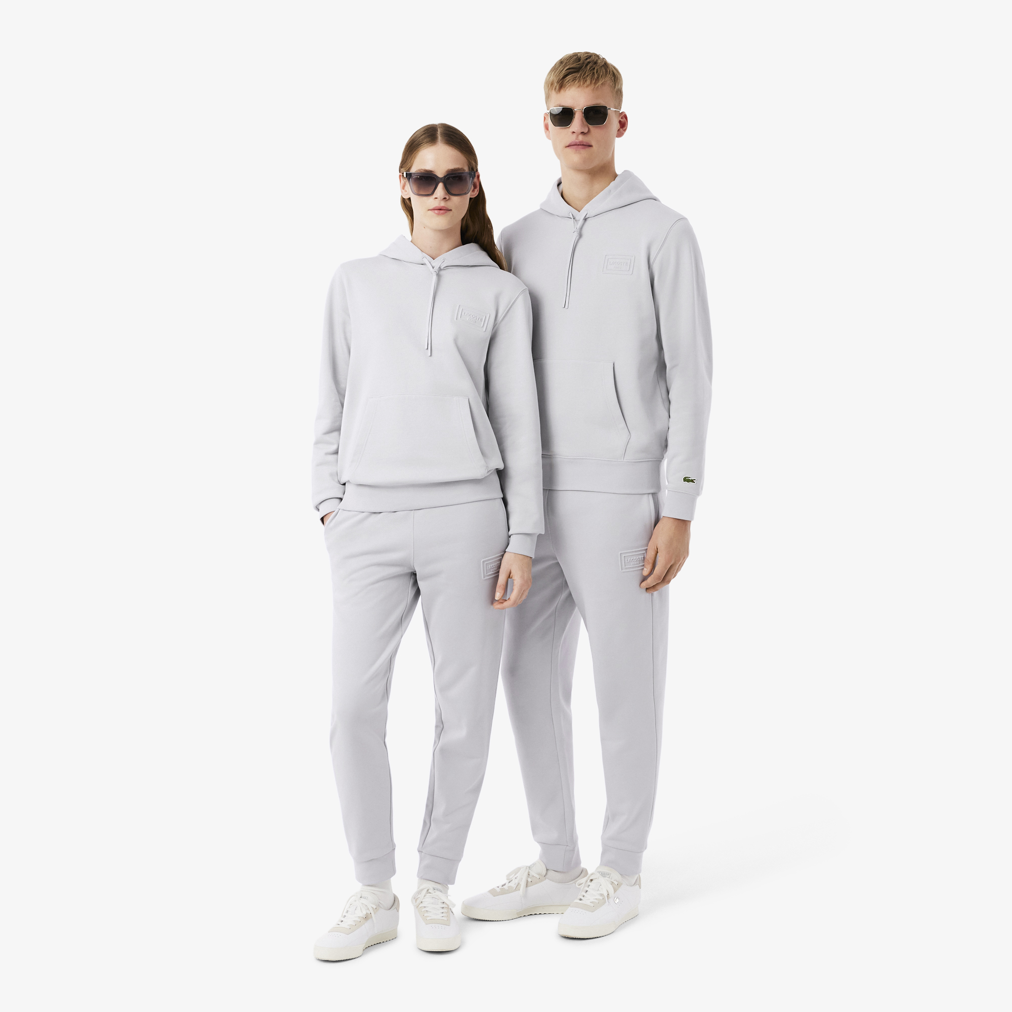 Quần Nỉ Lacoste Unisex Ống Côn Logo Dập Nổi
