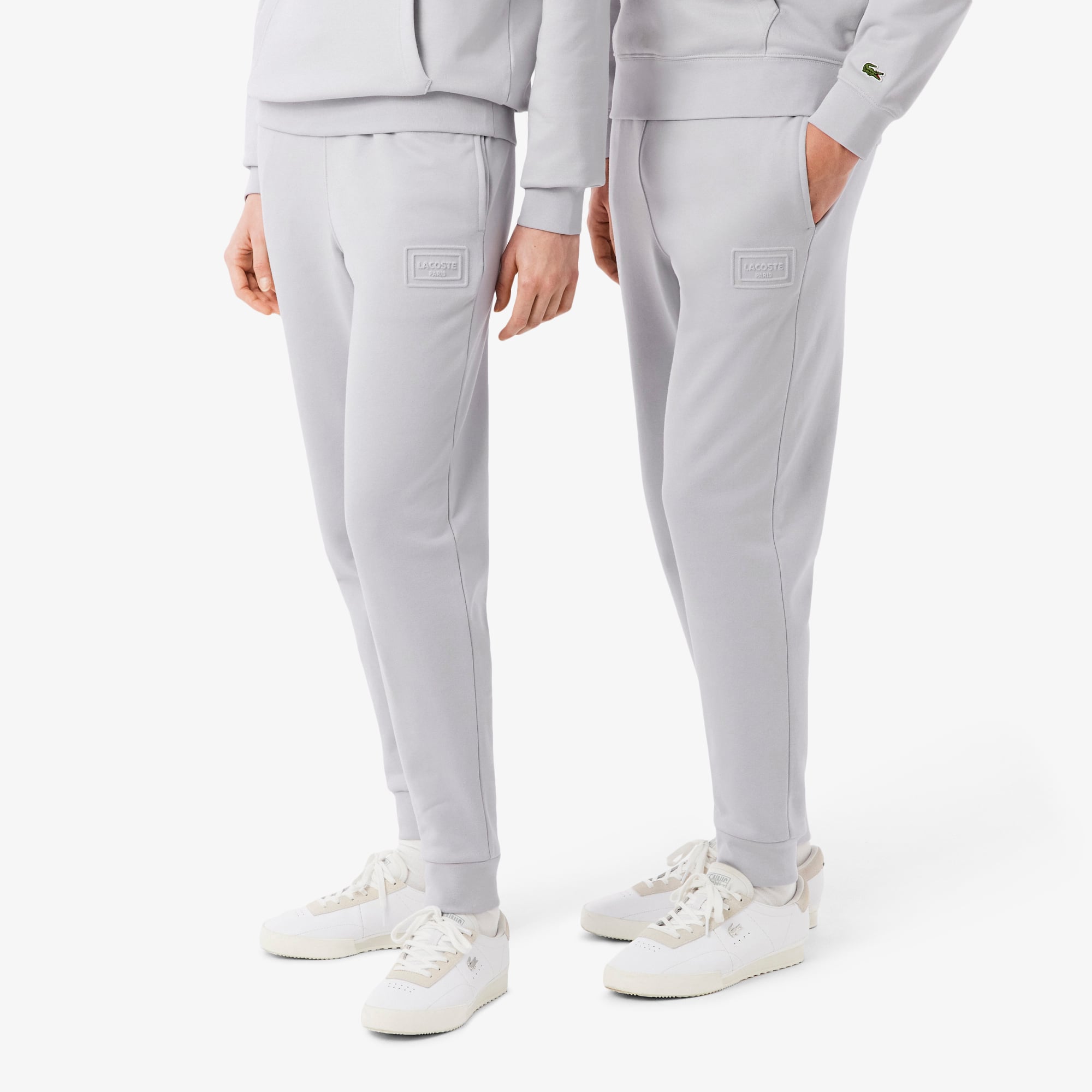 Quần Nỉ Lacoste Unisex Ống Côn Logo Dập Nổi