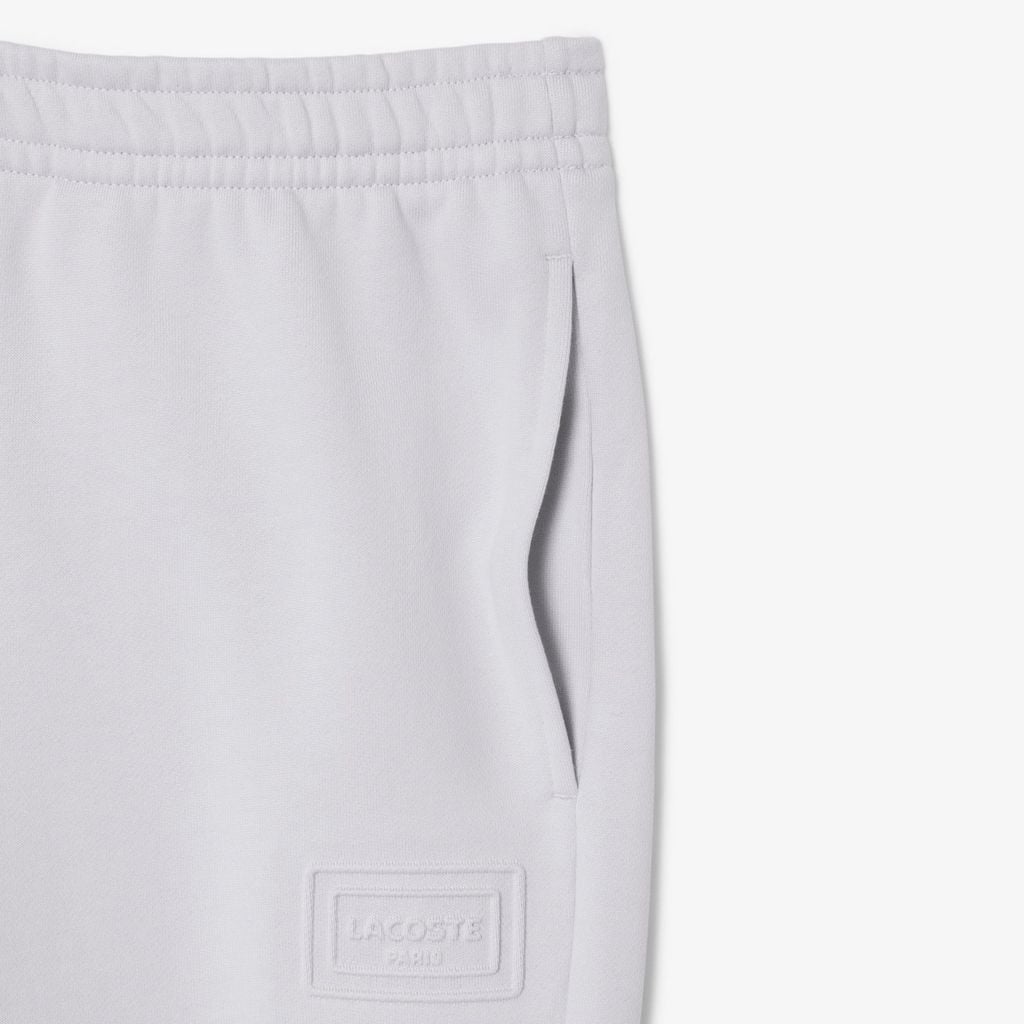 Quần Nỉ Lacoste Unisex Ống Côn Logo Dập Nổi
