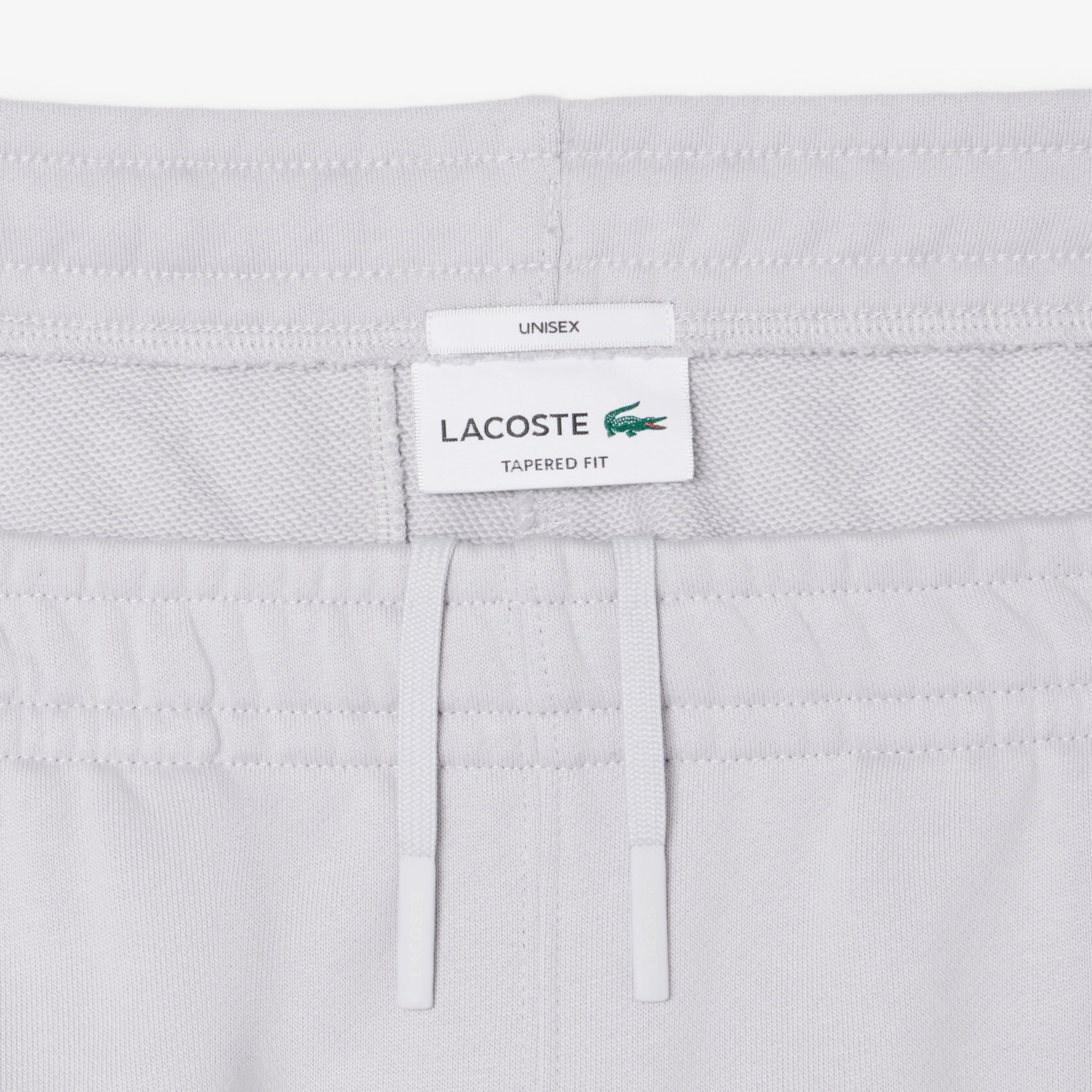 Quần Nỉ Lacoste Unisex Ống Côn Logo Dập Nổi