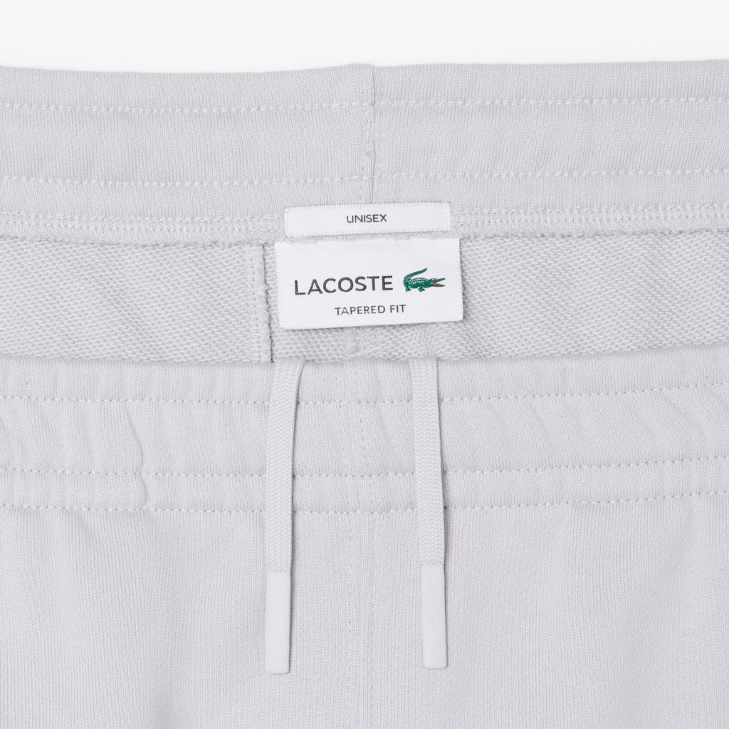 Quần Nỉ Lacoste Unisex Ống Côn Logo Dập Nổi