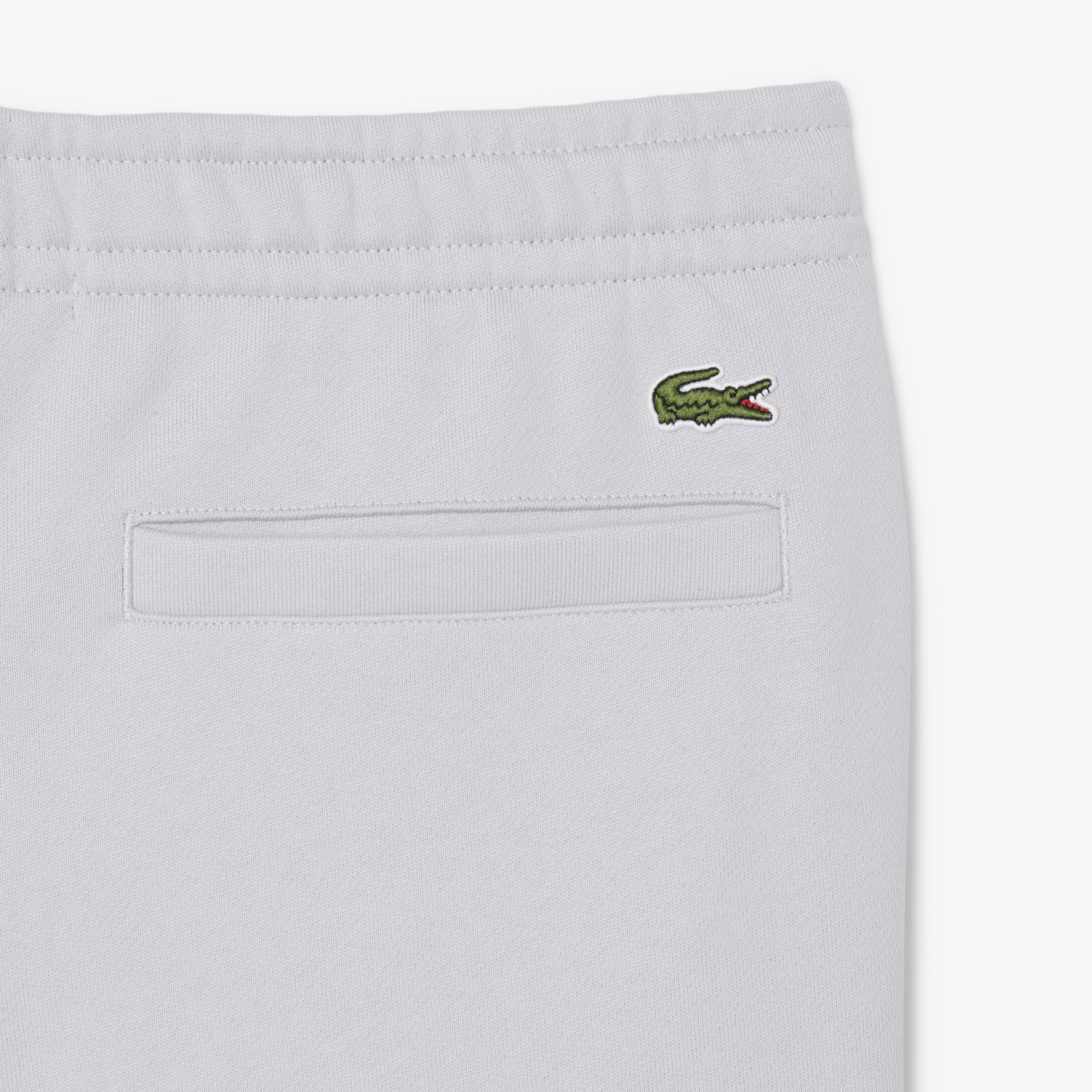 Quần Nỉ Lacoste Unisex Ống Côn Logo Dập Nổi