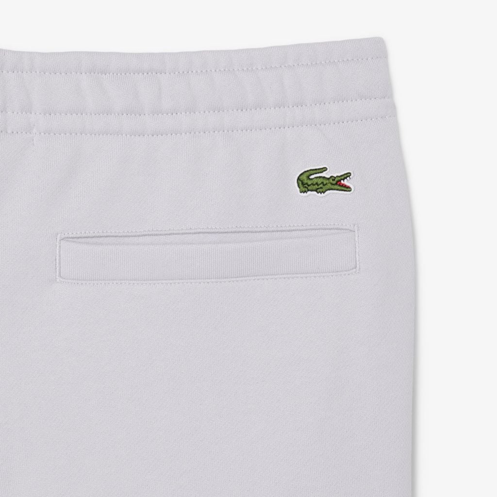 Quần Nỉ Lacoste Unisex Ống Côn Logo Dập Nổi