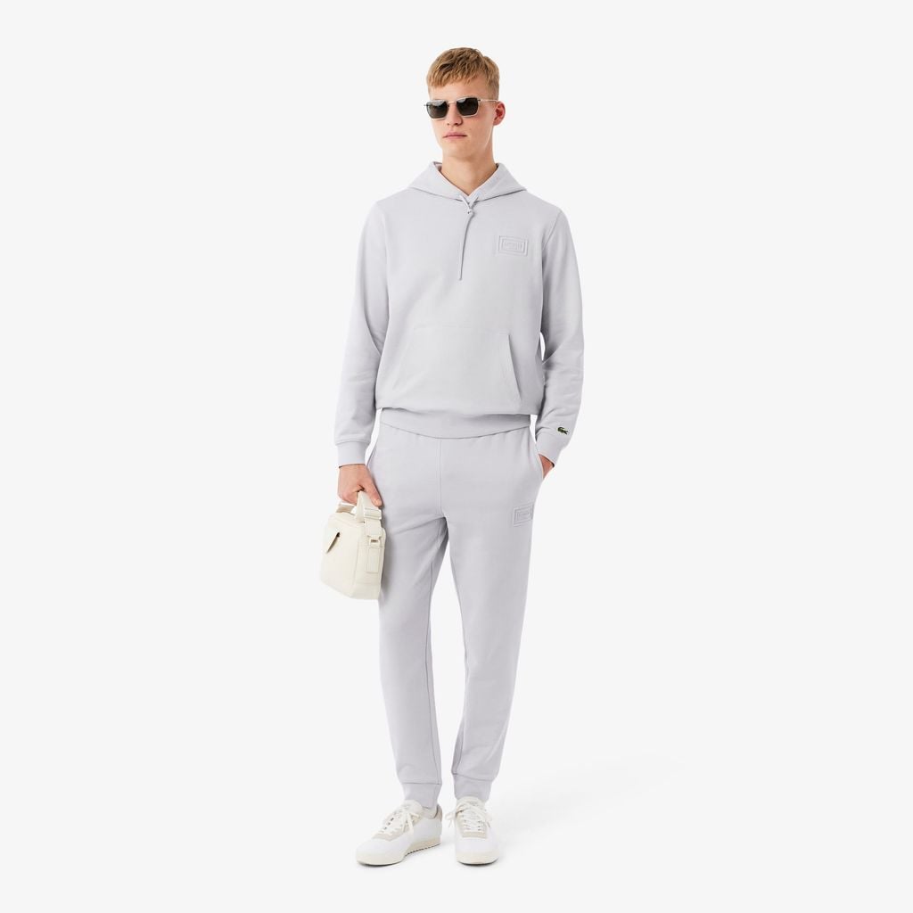 Quần Nỉ Lacoste Unisex Ống Côn Logo Dập Nổi