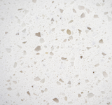 Iced White quartz surface with bright white base and soft translucent speckled pattern.