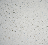 Ocean White quartz surface with white base and soft translucent crystal chip pattern.