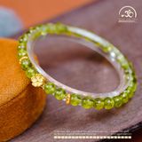  Vòng Tay Đá Peridot 6mm 5A Phối Charm Hoa Mai 
