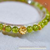  Vòng Tay Đá Peridot 6mm 5A Phối Charm Hoa Mai 