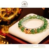  Vòng Tay Thạch Anh Dâu Xanh 10mm 5A Phối Charm Nơ Đính Ngọc Lục Bảo 