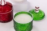 Glass Candle Jar With Christmas Decor On The Lid
