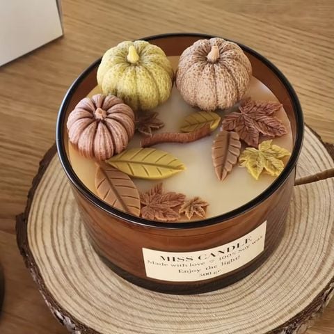 Brown Glass Candle Jar With Wax Decoration