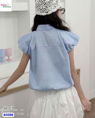 Áo sơ mi xanh nút hoa