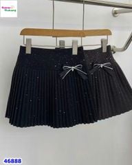 Chân váy xếp ly đen đính nơ