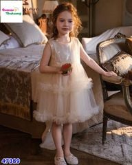 Đầm kem đính cườm nơ