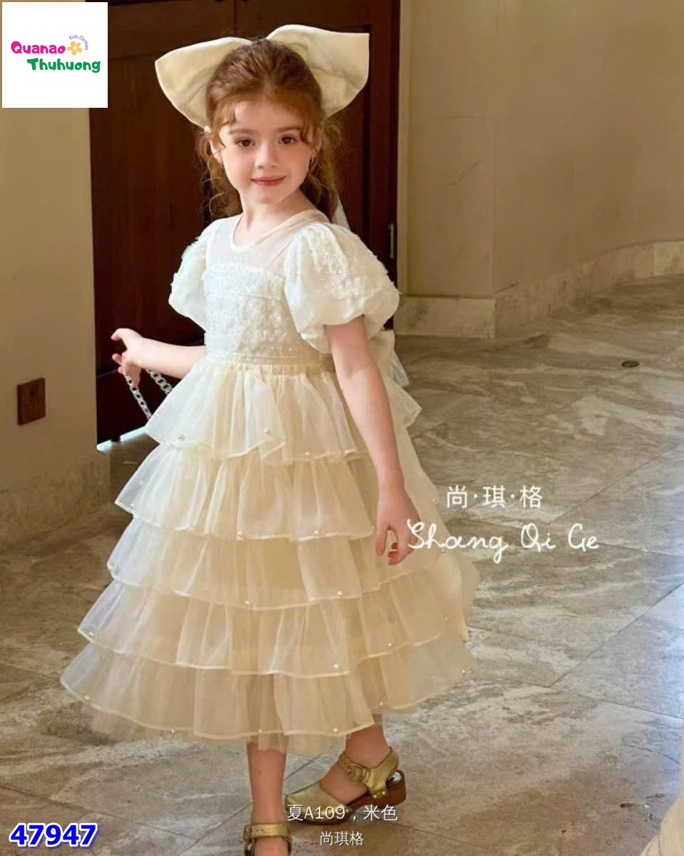 Đầm tiệc kem tầng đính nơ